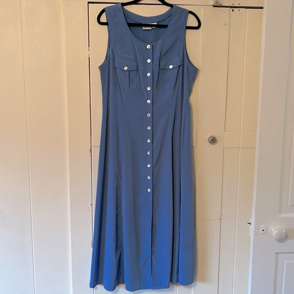 Periwinkle sheen polyester, like brushed satin, trimmed with real shell buttons